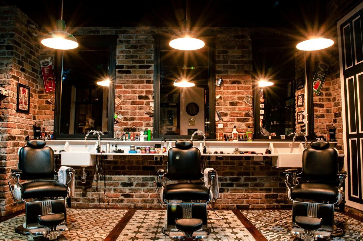 Shear Society interior — barber chairs